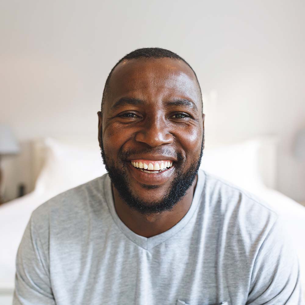 portrait of happy african american man looking at KY33EHT